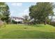 Expansive backyard features an in-ground firepit and mature trees at 4536 Misty Morn Cir, Orlando, FL 32812