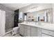 Modern bathroom with a dual vanity, shower with geometric tile, and ample natural light at 4536 Misty Morn Cir, Orlando, FL 32812