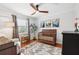 Charming Bedroom features wood floors, a ceiling fan, a modern crib and eclectic decor at 4536 Misty Morn Cir, Orlando, FL 32812