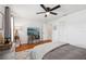 Inviting bedroom with wood floors, ceiling fan, white walls and a mounted television at 4536 Misty Morn Cir, Orlando, FL 32812