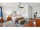 Bright bedroom with modern furnishings, a vaulted ceiling, and a connecting bathroom at 4536 Misty Morn Cir, Orlando, FL 32812