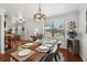Charming dining room with a large window and wood floors at 4536 Misty Morn Cir, Orlando, FL 32812