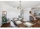 Charming dining room boasts a rustic wood table, stylish chairs, and modern lighting, creating an inviting space for gatherings at 4536 Misty Morn Cir, Orlando, FL 32812