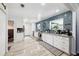 Bright kitchen with white cabinetry, stainless steel appliances, and tile flooring at 4536 Misty Morn Cir, Orlando, FL 32812