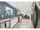 Open kitchen with stainless steel appliances and view into living area at 4536 Misty Morn Cir, Orlando, FL 32812