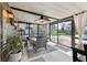 Bright lanai with ceiling fan, curtains, and sliding glass doors opening to the backyard and pool area at 4536 Misty Morn Cir, Orlando, FL 32812