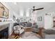 Bright and airy living room features hardwood floors, a fireplace, and comfortable seating, ideal for relaxation and entertaining guests at 4536 Misty Morn Cir, Orlando, FL 32812