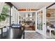 Inviting screened-in porch leads to living room with fireplace and comfortable seating at 4536 Misty Morn Cir, Orlando, FL 32812