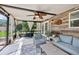 Relaxing sunroom with cozy seating, rustic wood accents, and plenty of natural light at 4536 Misty Morn Cir, Orlando, FL 32812