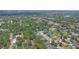 Wide aerial view of a quiet neighborhood featuring homes with well-manicured lawns and verdant landscaping at 460 Suncrest Ct, Oviedo, FL 32765