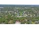 Aerial view of the community showcasing lush trees, landscaping and diverse home styles at 460 Suncrest Ct, Oviedo, FL 32765