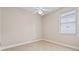 Bright, neutral bedroom featuring tile floors, a ceiling fan and window at 460 Suncrest Ct, Oviedo, FL 32765