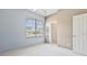 Bedroom with light blue walls and white trim features a large window and closet at 460 Suncrest Ct, Oviedo, FL 32765