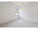 A clean, carpeted bedroom with a ceiling fan and bright window at 460 Suncrest Ct, Oviedo, FL 32765