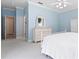 Light blue bedroom featuring crown molding, white furniture, and an open doorway at 460 Suncrest Ct, Oviedo, FL 32765