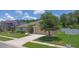 Attractive home with manicured lawn, mature trees, and a two-car garage at 460 Suncrest Ct, Oviedo, FL 32765