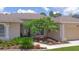 Inviting home exterior with a well-manicured garden and walkway at 460 Suncrest Ct, Oviedo, FL 32765