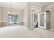 Inviting foyer boasts neutral walls, tile flooring, and a stylish front door at 460 Suncrest Ct, Oviedo, FL 32765