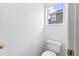Clean half-bath featuring a white toilet and neutral walls at 460 Suncrest Ct, Oviedo, FL 32765