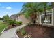 Lush landscaping surrounds the front of this beautiful home, creating a welcoming entrance at 460 Suncrest Ct, Oviedo, FL 32765