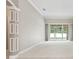 Spacious living area showcasing sliding glass doors that open to the backyard at 460 Suncrest Ct, Oviedo, FL 32765