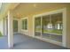Covered patio with sliding glass doors, offering seamless indoor/outdoor living at 460 Suncrest Ct, Oviedo, FL 32765