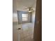 Inviting bedroom features tile floors, a ceiling fan and plenty of natural light at 5265 Broken Arrow Dr, Kissimmee, FL 34746