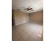 Spacious bedroom with tile flooring, ceiling fan, and neutral paint at 5265 Broken Arrow Dr, Kissimmee, FL 34746