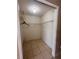 Walk-in closet with wire shelving and tile floor at 5265 Broken Arrow Dr, Kissimmee, FL 34746