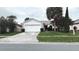 Charming single-story home with a well-maintained lawn and mature landscaping at 5265 Broken Arrow Dr, Kissimmee, FL 34746