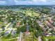Beautiful aerial view of a property nestled in a serene neighborhood with mature trees and manicured lawns at 5704 Bay Side Dr, Orlando, FL 32819