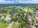 Aerial view of the community featuring lush greenery, and sprawling golf course at 5704 Bay Side Dr, Orlando, FL 32819