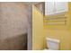 Modern bathroom featuring a walk-in shower and a commode with storage at 5704 Bay Side Dr, Orlando, FL 32819