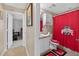 Bathroom featuring Ohio State Buckeyes decor, a vanity, and a shower with a red Buckeye curtain at 5704 Bay Side Dr, Orlando, FL 32819