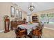 Cozy dining room featuring wood furniture, decorative accents, and a large window at 5704 Bay Side Dr, Orlando, FL 32819