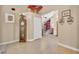 Inviting foyer featuring neutral tile flooring, a decorative fan and view into living spaces at 5704 Bay Side Dr, Orlando, FL 32819