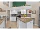 Bright kitchen with granite countertops, stainless steel appliances and mosaic tile backsplash at 5704 Bay Side Dr, Orlando, FL 32819