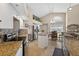 Bright kitchen with granite countertops, stainless steel appliances, and a vaulted ceiling with dining area at 5704 Bay Side Dr, Orlando, FL 32819