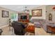 Well-lit living room featuring tile floors, large windows, and comfortable furniture at 5704 Bay Side Dr, Orlando, FL 32819