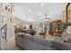 Comfortable living room with neutral colors, a ceiling fan, and large windows at 5704 Bay Side Dr, Orlando, FL 32819
