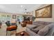 Cozy living room with tile flooring, large windows, and comfortable furniture at 5704 Bay Side Dr, Orlando, FL 32819