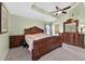 Beautiful main bedroom showcasing a tray ceiling and ornate furniture at 5704 Bay Side Dr, Orlando, FL 32819