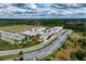 New school has many parking spaces, athletic fields, and is surrounded by the lush greenery of a vibrant tree line at 6346 Dallas Blvd, Orlando, FL 32833