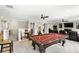 Large finished basement featuring a pool table, game area, and comfortable seating at 6346 Dallas Blvd, Orlando, FL 32833
