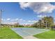 Enjoy outdoor games on this well-maintained basketball court with multiple hoops, surrounded by green space and trees at 6346 Dallas Blvd, Orlando, FL 32833