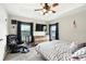 Bedroom with a ceiling fan, large windows, and plenty of room at 6346 Dallas Blvd, Orlando, FL 32833