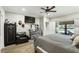 Neutral bedroom with a queen bed, ceiling fan, luxury vinyl flooring and large dresser at 6346 Dallas Blvd, Orlando, FL 32833