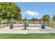 Community dog park provides a secure area for pets to exercise and socialize with benches and water fountain at 6346 Dallas Blvd, Orlando, FL 32833