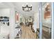 Bright entryway with wood floors, stylish console table, chandelier, and an inviting view into the living spaces at 6346 Dallas Blvd, Orlando, FL 32833