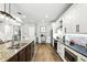 Well-appointed kitchen with stainless steel appliances, granite countertops and a large island with barstool seating at 6346 Dallas Blvd, Orlando, FL 32833
